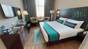 Signature Hotel Apartments and Spa kambarys